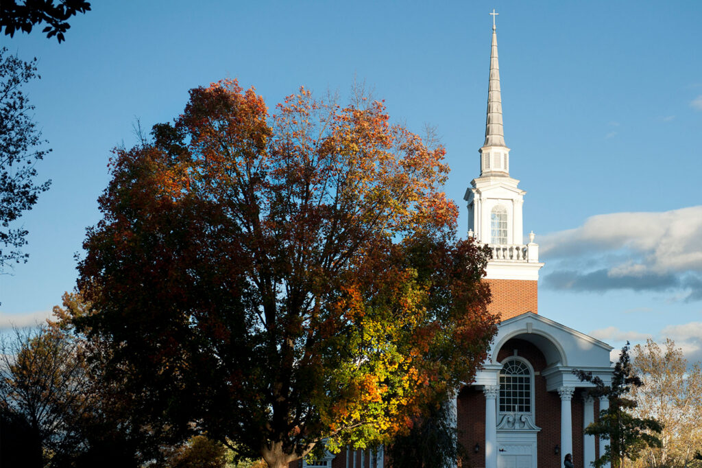 Chaplaincy on campus with a chapel exterior and autumn trees, showing a welcoming space for student support"