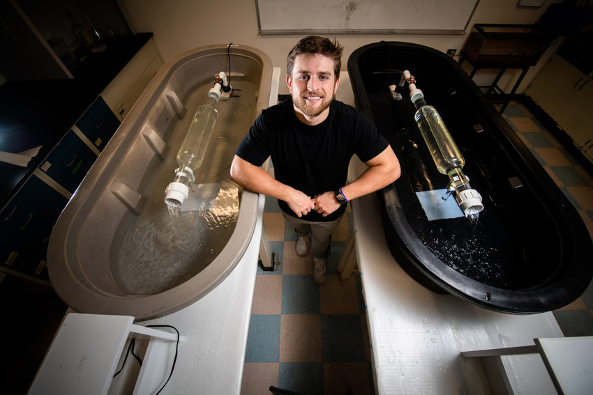 Student looking at the camera in a research setting